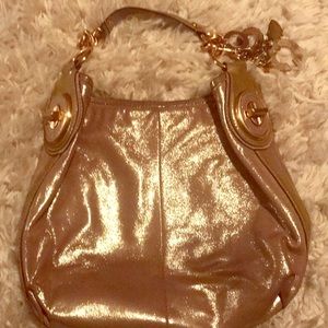 Rose gold metallic coach purse